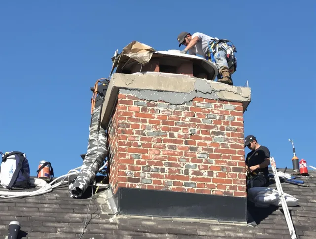 Pomona Chimney Sweep installing a custom chimney crown in Pomona, CA