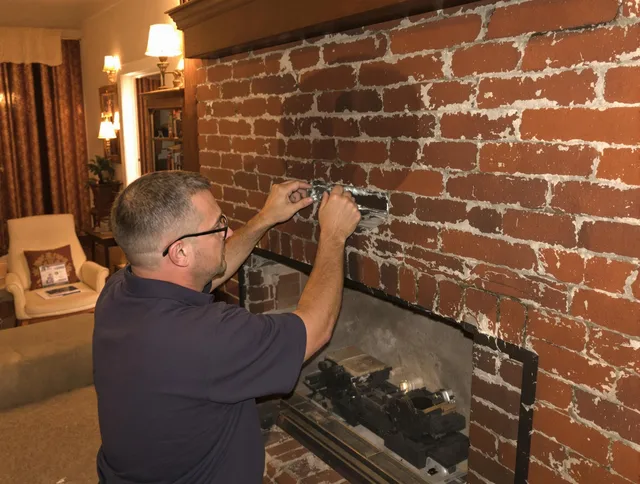 Pomona Chimney Sweep expert fixing a fireplace in Pomona, CA